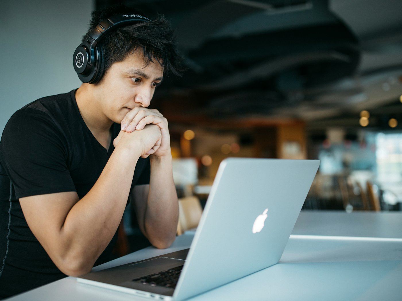 A student in headphones attending an online class